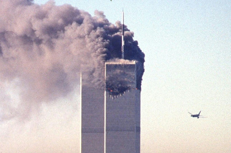 United Airlines Flight 175 is seen approaching the south tower of the World Trade Center as smoke billows from the north tower in lower Manhattan, New York on September 11, 2001