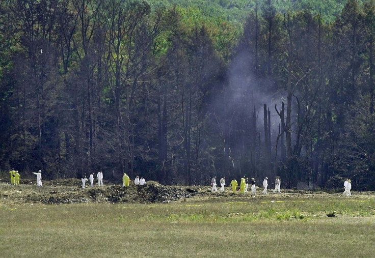 Investigative personnel search the crash site of United Airlines Flight 93 looking for debris and evidence in Shanksville, Pennsylvania