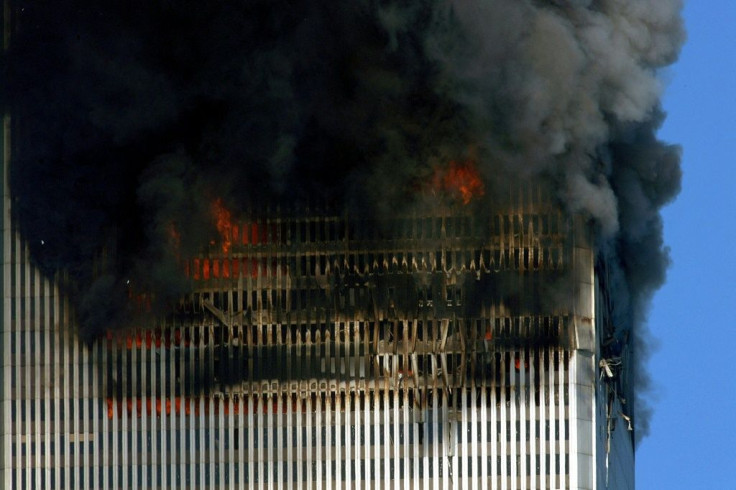 Smoke and flames billow out of the World Trade Center before their collapse in lower Manhattan on September 11, 2001