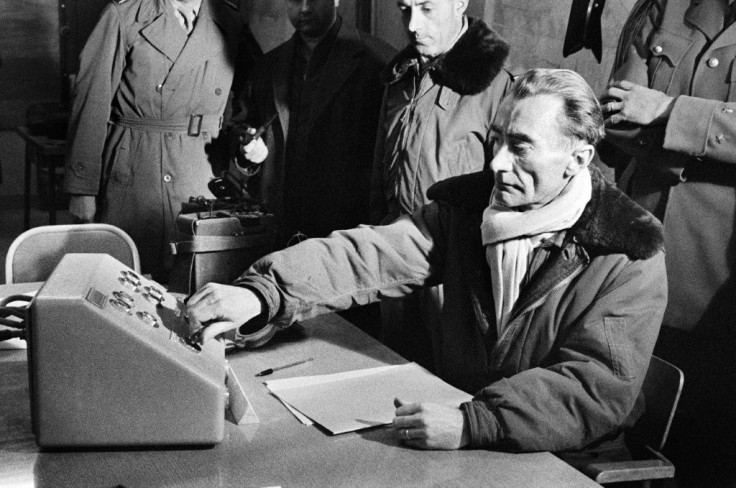 French General Jean Thiry presses the button which triggers the third French nuclear test explosion in the Algerian Sahara in 1960