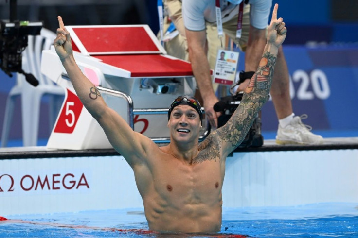 USA's Caeleb Dressel celebrates winning Olympic gold in the 100m freestyle