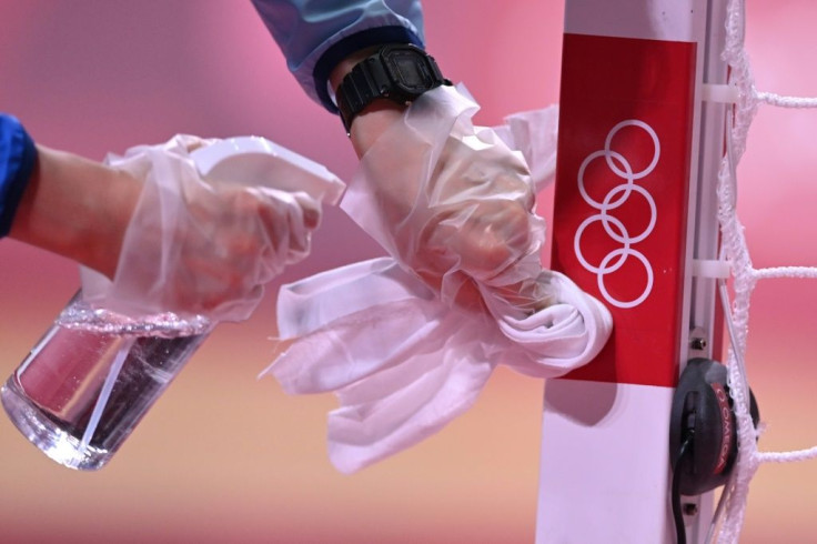 Olympic organisers have defended their virus countermeasures after reporting new cases among participants