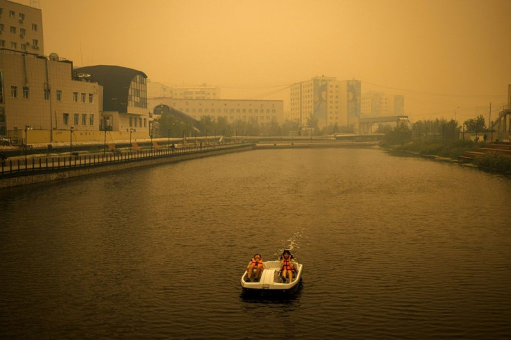 Smoke from nearby forest fires hangs over the city of Yakutsk: Russia's environment minister says firefighters must prioritise inhabited areas