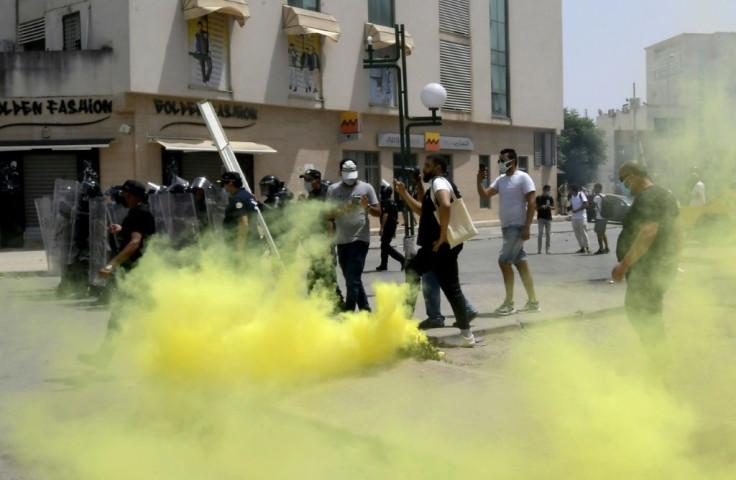 Tunisian security forces clashed with anti-government protesters in front of the parliament in the capital Tunis on July 25
