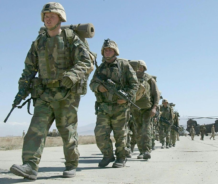 US soldiers arrive at Bagram Air Base, in Afghanistan in 2002: experts say the two-decade US war effort has 'failed' due to hubris and misundertanding