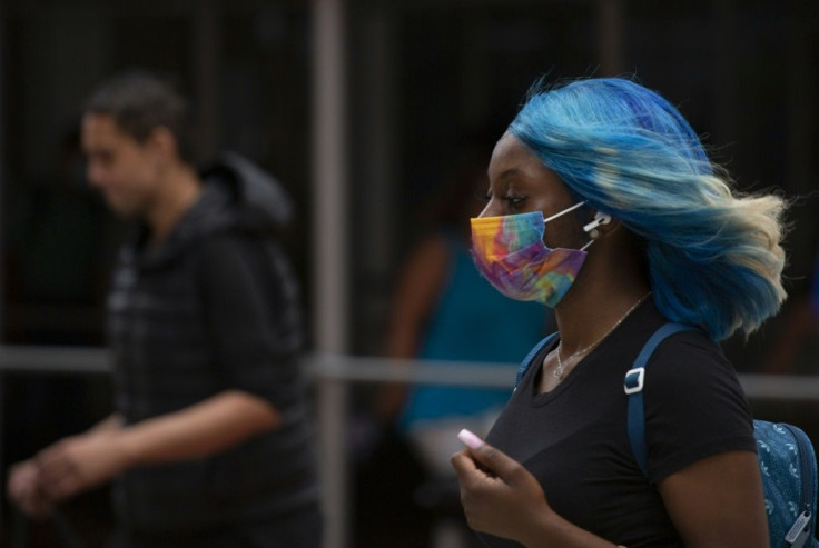 Face masks are reappearing in cities around the world as the Delta variant fuels a surge in coronavirus cases