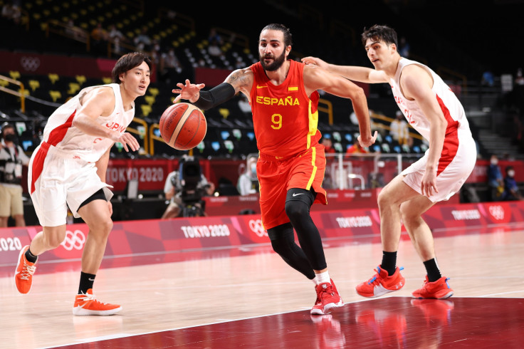 Ricky Rubio #9 of Team Spain drives past Daiki Tanaka #24 and Avi Koki Schafer #32 of Team Japan