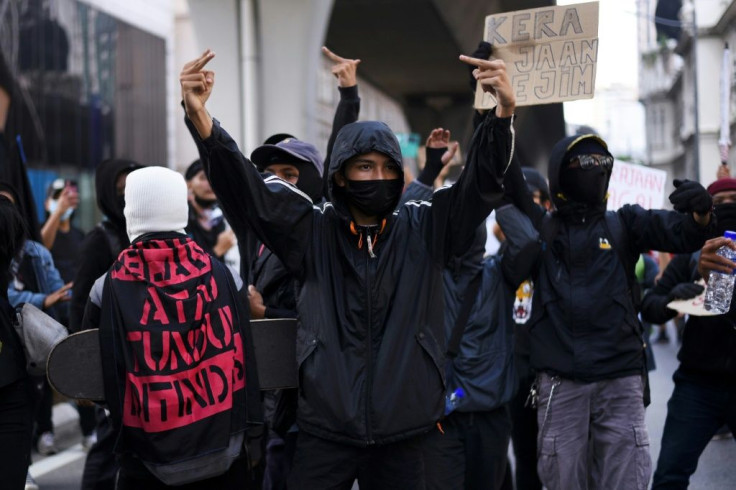 The protesters wore masks and largely kept a distance from one another