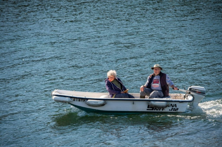 Oliver and her son head back to land after a morning of hauling in their lobster traps off the coast of Maine