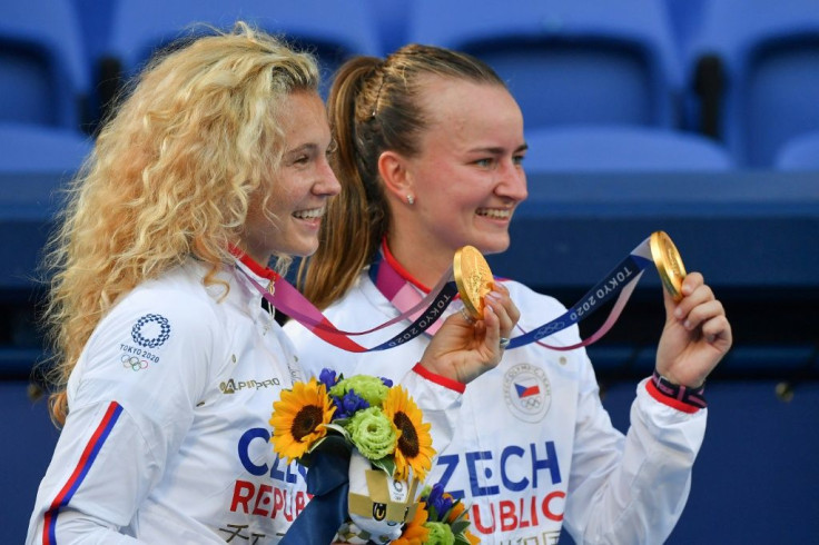 Czech Republic's Barbora Krejcikova (R) and Katerina Siniakova pose with their gold medals