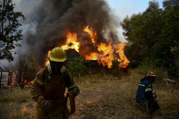 Nearly 300 firefighters, two water bomber planes and five helicopters were battling to put out a forest fire in Greece