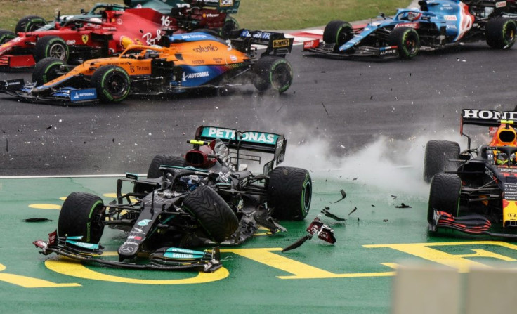 Mercedes' Valtteri Bottas collides with Red Bull's  Sergio Perez on the opening lap of the Hungarian Grand Prix