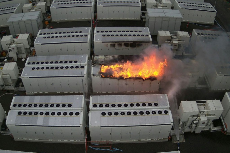 This handout picture taken on July 30, 2021 and released on August 2 by Fire Rescue Victoria shows a fire from a 13-tonne lithium battery unit at a Tesla battery site in Australia