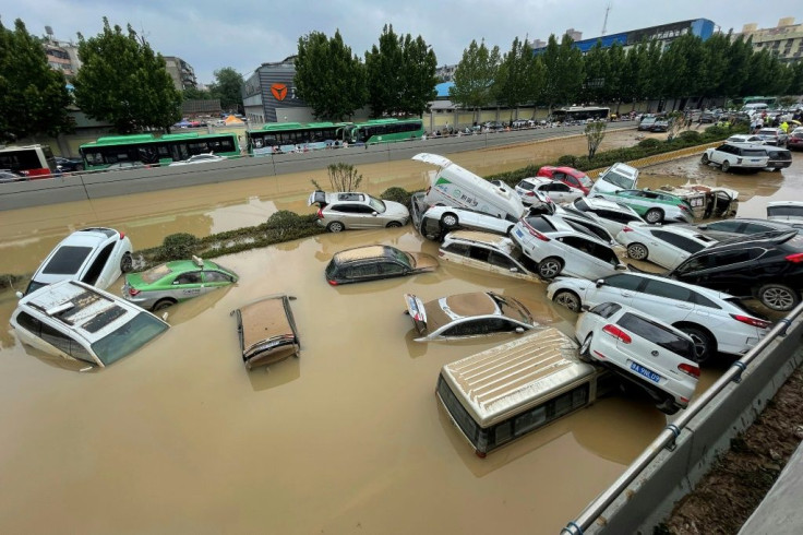 Residents were trapped in subway carriages, underground car parks, and tunnels as central China was hit by a year's worth of rain in three days.