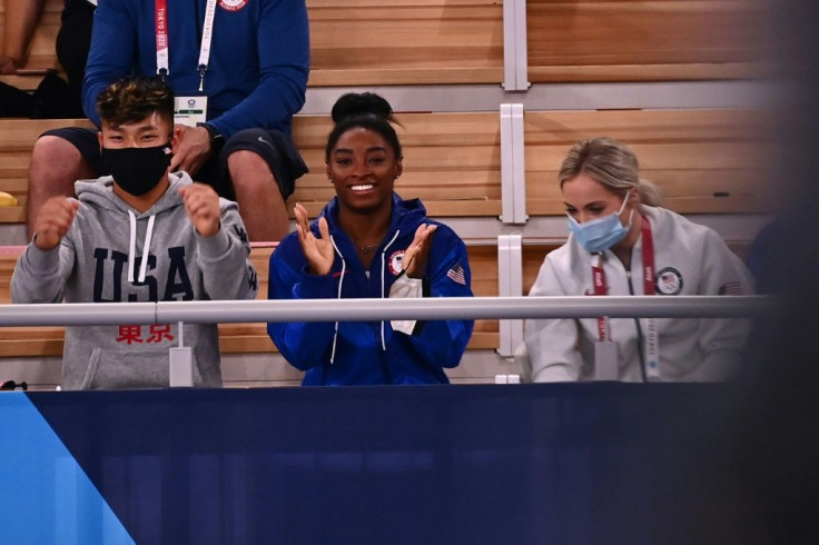 USA's Simone Biles (C) has been cheering from the sidelines since pulling out during the team final