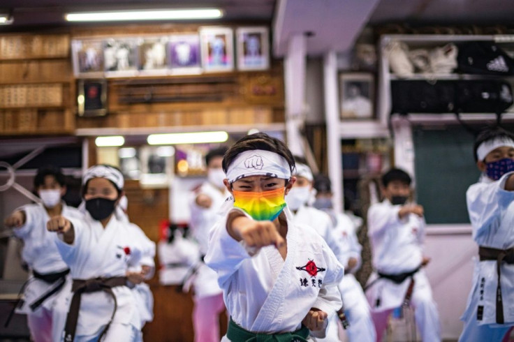 Students practise karate at a dojo in Tokyo