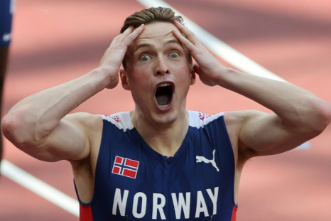 Norway's Karsten Warholm wiped a huge chunk off his own 400m hurdles world record to win Olympic gold