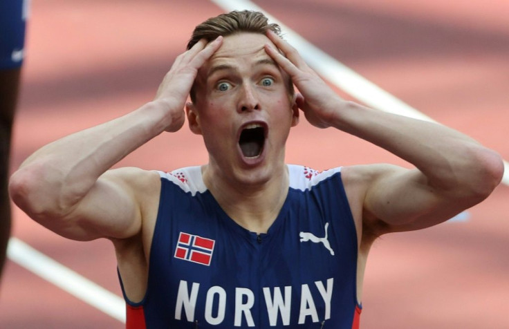 Norway's Karsten Warholm wiped a huge chunk off his own 400m hurdles world record to win Olympic gold