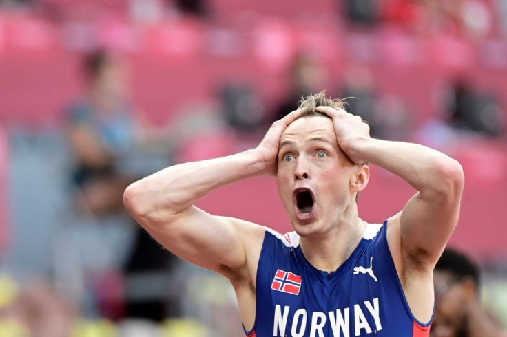 Norway's Karsten Warholm reacts after breaking the world record to win the men's 400m hurdles at the Tokyo Olympics