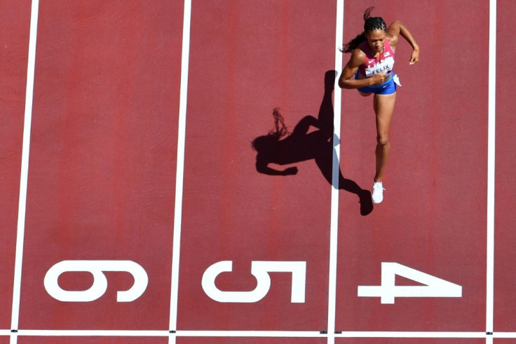 US sprinter Allyson Felix runs in the women's 400m heats at the Tokyo Olympics