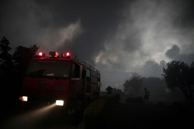 Police and firefighters have evacuated hundreds of people from suburbs north of Athens