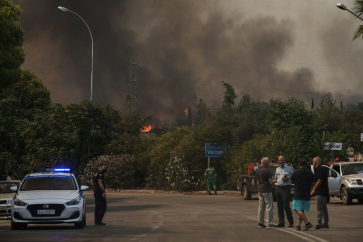 The fire brigade said five helicopters, five water-bombing aircraft, 70 fire trucks and 350 firemen were fighting the flames