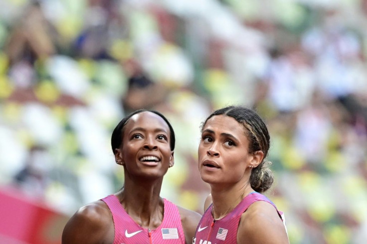 Sydney McLaughlin (right) beat US rival Dalilah Muhammad in the final of the women's 400m hurdles, setting a new world record