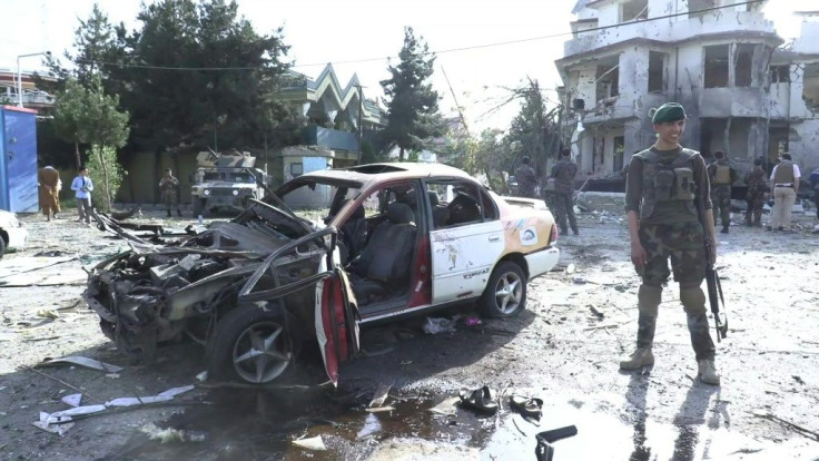 IMAGES Security sources on the scene the morning after a coordinated bomb and gun attack targeting the Afghan defence minister and several lawmakers in the country's capital, not far from the heavily fortified Green Zone.