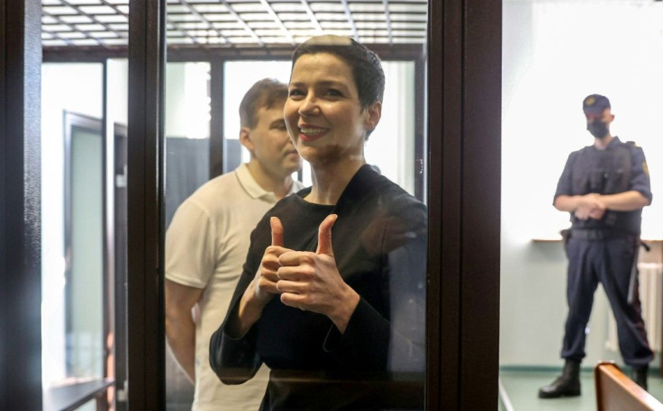Maria Kolesnikova, the last remaining protest leader still in Belarus, gives the thumbs up from her defendant's cage as her trial begins in Minsk