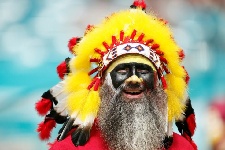 Fans wearing Native American face paint or headresses, such as this Washington NFL supporter from a 2019 game in Miami, will no longer be allowed in Washington Football Team home games, the NFL club said Wednesday