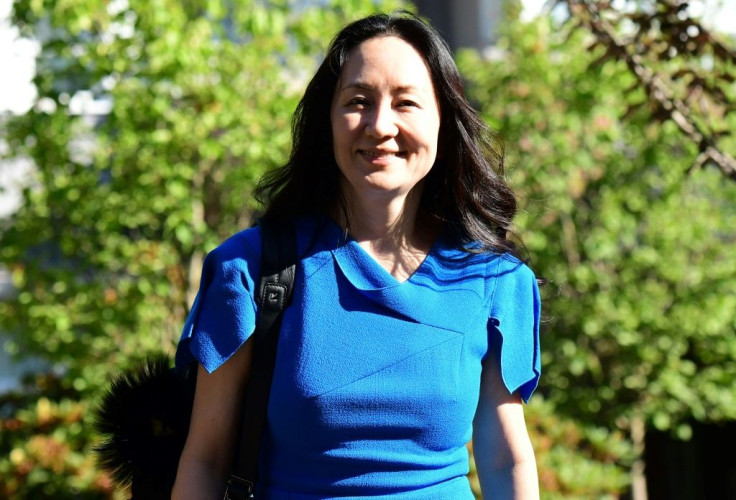 Huawei's chief financial officer Meng Wanzhou smiled as she left her residence in Vancouver for a new round of court hearings over a US extradition request