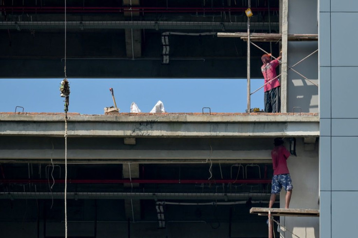 Labourers work on a construction site for an office building in Jakarta. Indonesia's economy bounced back in the second quarter