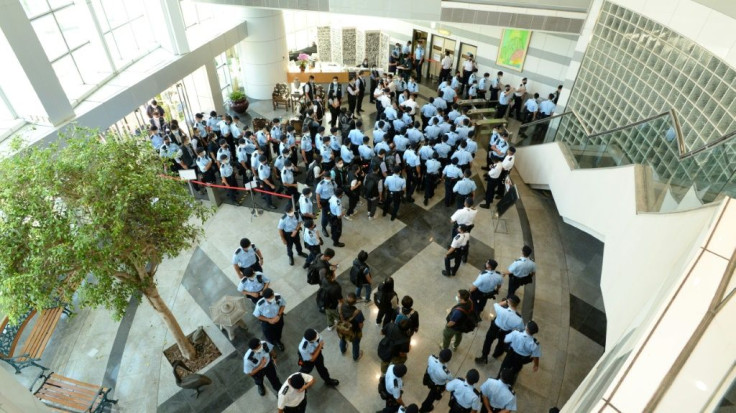 Hong Kong Police raid the offices of pro-democracy newspaper Apple Daily in June 2021