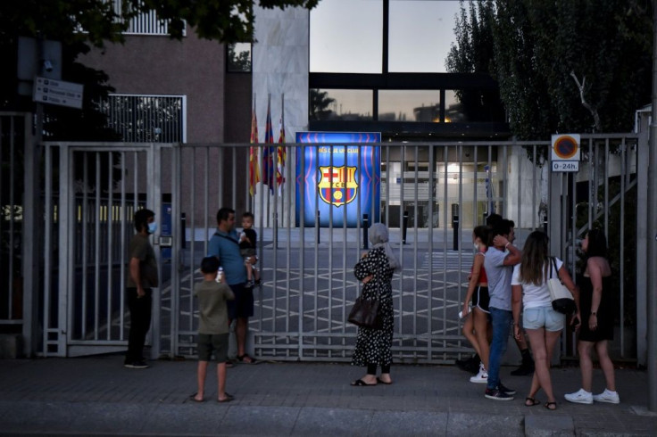 'Bombshell': Barcelona supporters gather in front of the Camp Nou stadium in Barcelona