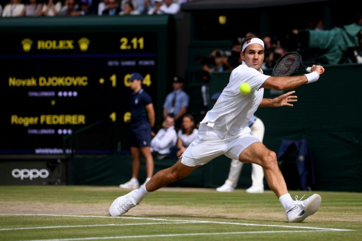 So close: Roger Federer returns the ball to Novak Djokovic in their epic 2019 Wimbledon final