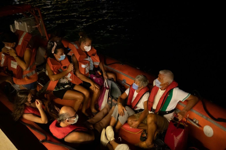 Villagers were evacuated by sea by Turkish coastguards after a deadly wildfire engulfed the outer edges of the 35-year-old Kemerkoy thermal power plant storing thousands of tonnes of coal