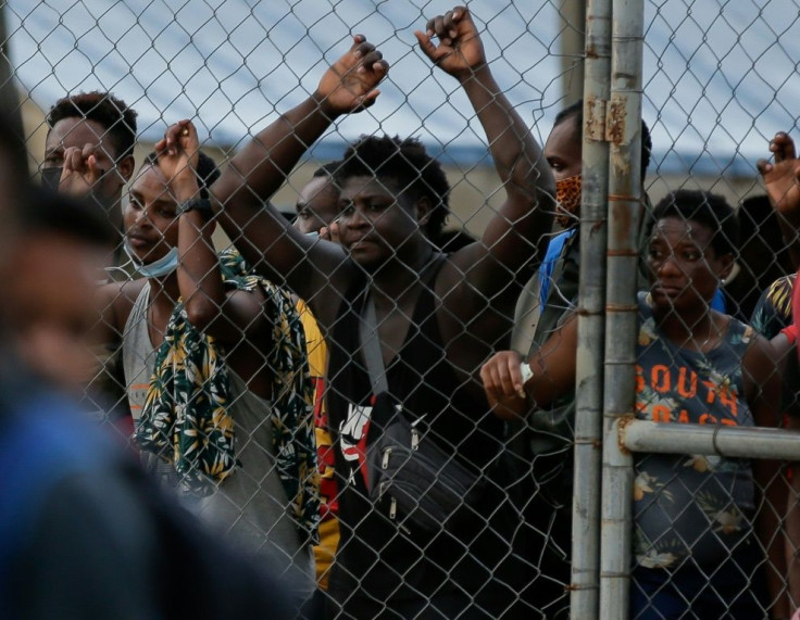A group of migrants wait to leave the San Vicente Migrant Reception Station in Meteti, Darien province, Panama, on August 5, 2021, on their way to the United States