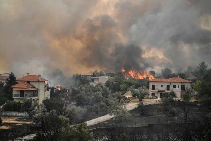 At least 1,450 Greek firefighters are battling the infernos along with aircraft