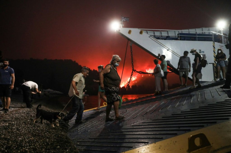 In the Evia village of Limni, more than 1,300 people fled the fires on ferry boats.