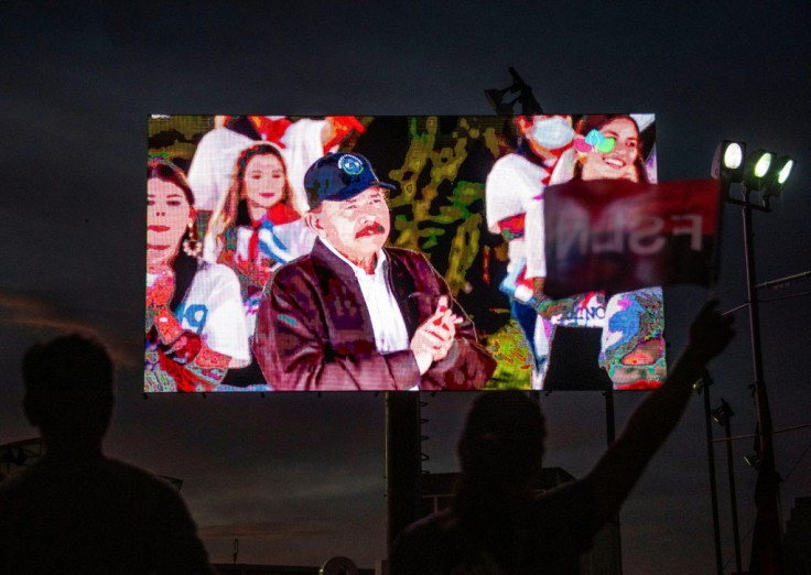 Supporters of Nicaraguan President Daniel Ortega watch his speech on July 19, 2021, during the celebration of the 42th anniversary of the Sandinista Revolution