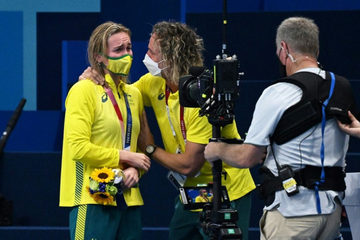 Australian swimmer Ariarne Titmus (L) is congratulated by her coach Dean Boxall