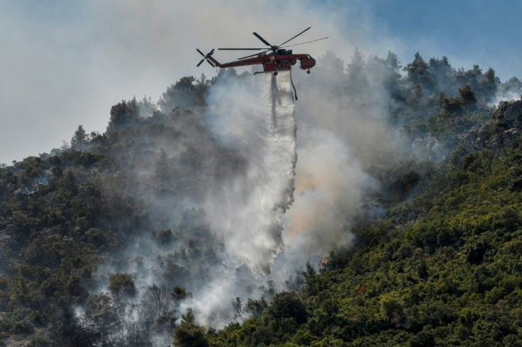 Hundreds of firefighters along with water-dropping aircraft are battling the blazes