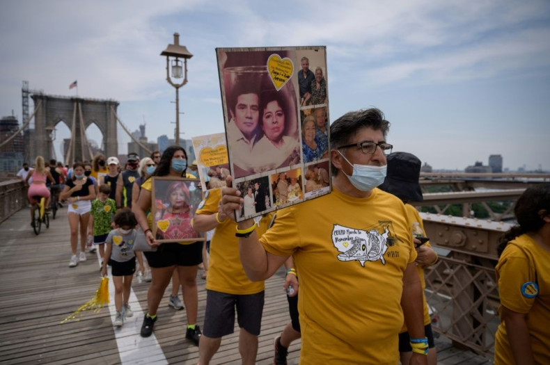 Relatives who lost family members to Covid-19 join survivors, community members and frontline health workers at a 'March to Remember' over the Brooklyn Bridge in New York on August 7, 2021