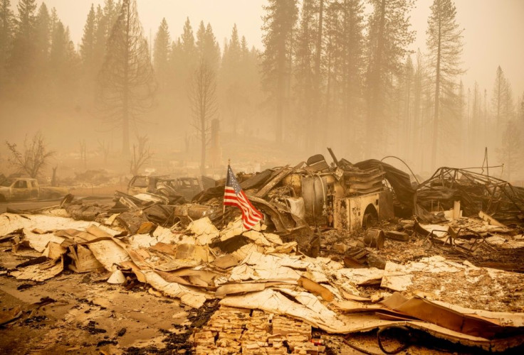 An American flag is placed at a burned fire station in downtown Greenville, California