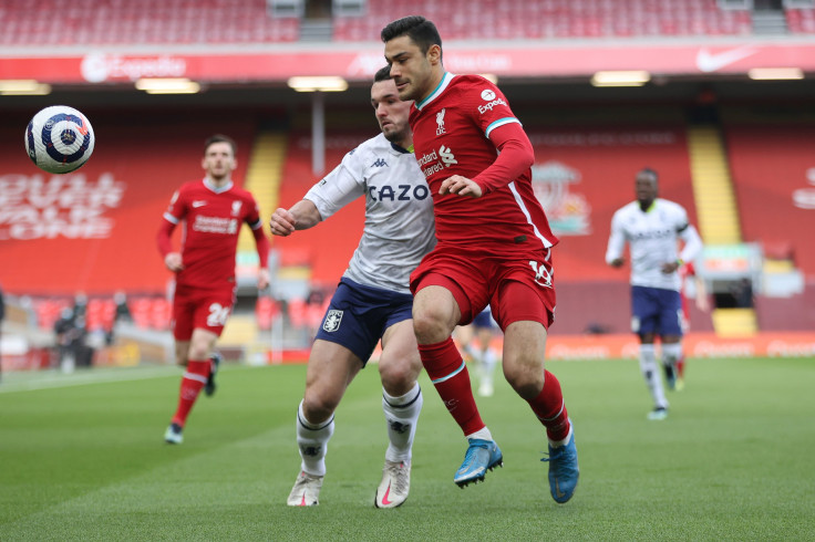 John McGinn of Aston Villa battles for the ball with Ozan Kabak of Liverpool