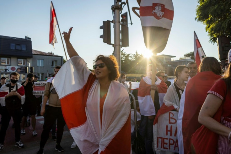 Activists and members of the Belarusian diaspora rally before the Belarussian embassy in Warsaw, Poland.