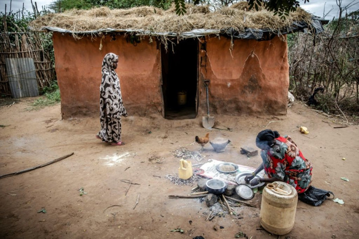 Kenyan farmer Amina Guyo, shown cooking a cowpea stew, depends on agro-pastoralism and the sale of khat to support her household of six