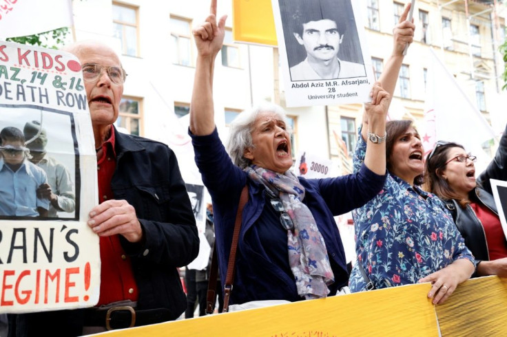 Several hundred protesters gathered outside the Stockholm court calling for justice for the estimated 5,000 prisoners killed across Iran in 1988