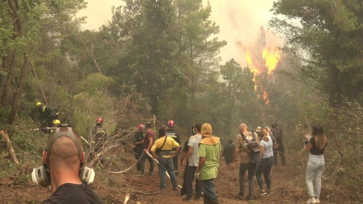 Fire burns as firefighters struggle to contain Greek fires