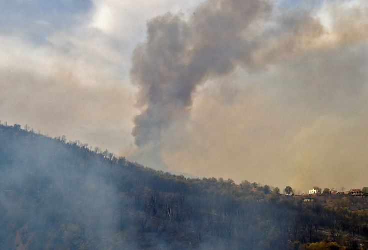 Smoke billows from a wildfire in the forested hills of the Kabylie region, east of the capital Algiers, on August 10, 2021